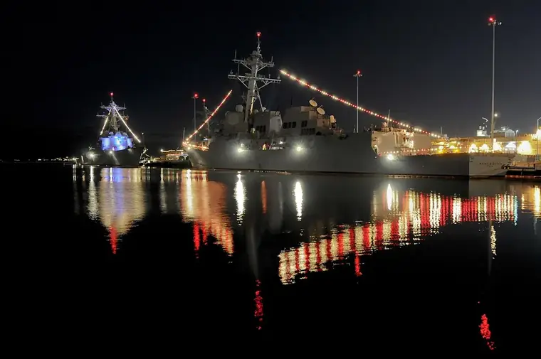Holiday lights reflected on the water at night